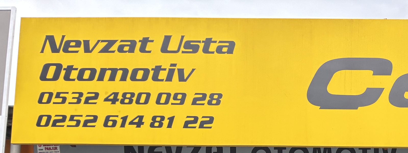 Nevzat Usta Otomotiv tabelası — Fethiye atölye markası